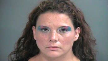Mug shot of woman accused of shoplifting $144 in eye shadow shows her in heavy eye makeup