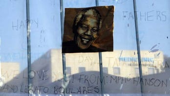 As South Africa watches, Mandela still in critical condition