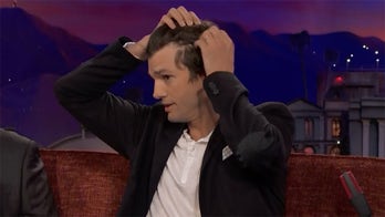 Ashton Kutcher reveals his receding hairline to Conan O'Brien: 'I'm experiencing the hair loss'