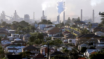 Australian parliament votes to scrap controversial carbon tax