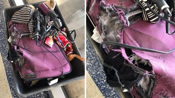 American Airlines apologizes to passenger for 'shredded' suitcase, missing items