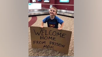Son's hilarious, embarrassing sign welcoming mom home at airport goes viral