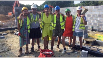 Bricklayers protest 'no shorts' dress code by wearing dresses