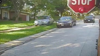 Man nabbed after video shows car driving onto sidewalk to pass stopped school bus