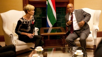 Charlize Theron pledges help in fight against AIDS