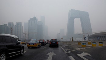 Beijing issues rare air pollution alert