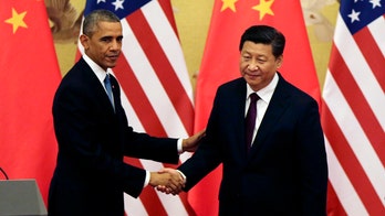Obama, Chinese President Xi downplay disagreements at joint news conference