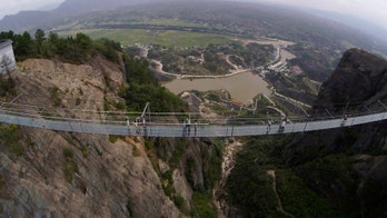 New glass suspension bridge in China is 980 feet long, 600 feet high, and absolutely terrifying