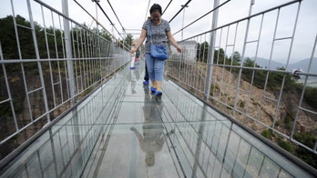 Crack forms in China’s terrifying glass suspension bridge