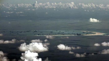 US warns China not to challenge military flights over South China Sea