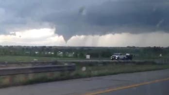 The Latest on Colorado tornadoes: Man wades in chest-deep water to find dog trapped rubble