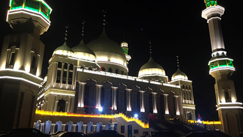 Religion must obey Chinese law, paper says of mosque protest