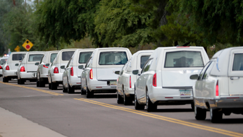 10 white caskets and memories: Funeral honors flood victims