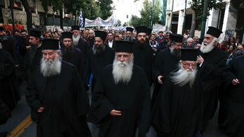 Greek protesters attack new religious instruction textbooks.