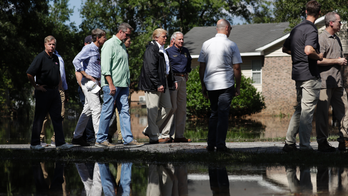 The Latest: Trump assures South Carolina as flooding lingers