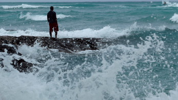 The Latest: Hotels bring in deck chairs as hurricane nears