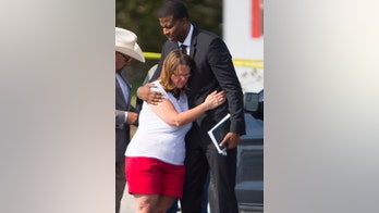 The Latest: 2 men who pursued gunman attend shooting vigil