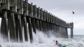 The Latest: Alberto downgraded to depression, rains persist