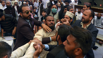 Pakistan's ex-PM Sharif dodges shoe thrown in seminary
