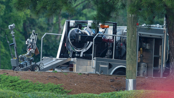 Man who claimed to have bomb at bank is killed by police