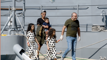 The Latest: Migrants delayed by bad weather reach Malta