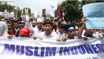The Latest: Indonesian groups protest Rohingya persecution