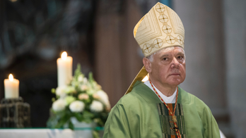 Ousted Vatican doctrine chief denies clashing with pope