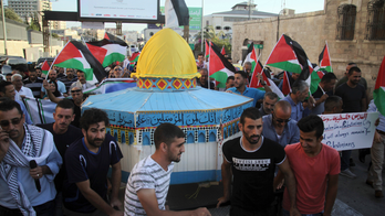 The Latest: Palestinians, Israeli police clash in Jerusalem