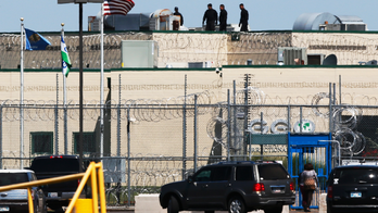 Inmates take 2 guards hostage in Oklahoma prison riot before officers gain control