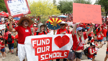 The Latest: Arizona district to keep schools closed Monday