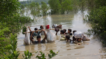 Myanmar leader blames misinformation as exodus worsens