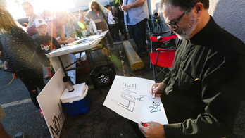 Vigil held to support Minnesota mosque where bacon was found