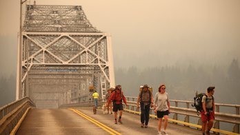 Wildfire smoke is choking the West but helping firefighters