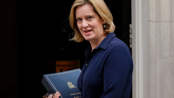 UK's May to replace minister as immigration scandal widens