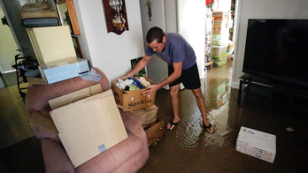 1 elderly couple: A decision to stay put despite Irma floods