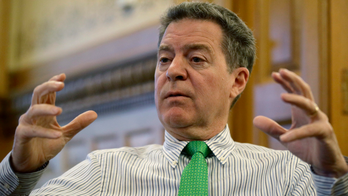 Brownback sees rolled-back Kansas cuts still shaping debate