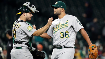 Olson's slam helps A's top Mariners 9-3, close in on Yankees