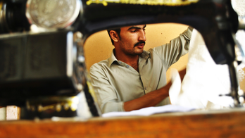 AP PHOTOS: Inside the changing world of a Pakistani tailor