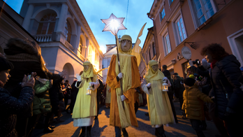 AP PHOTOS: World celebrates Epiphany with icy dips, parades
