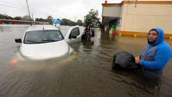 The Latest: 1,400 more prisoners on the move due to Harvey