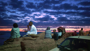 Moroccans break Ramadan fast on beach with song, dance, food