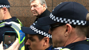 The Latest: Cardinal Pell wears clerical collar to court