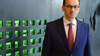 The Latest: Israel Holocaust center welcomes Polish law move
