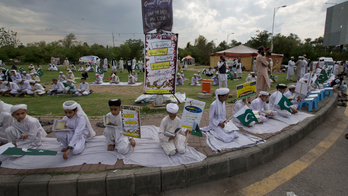Pakistan students pray for victims of airstrike in Kunduz