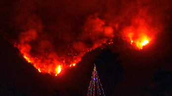 Latest: Crews protect hillside home as California fire roars