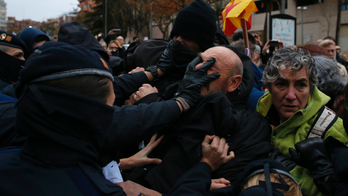 Protesters oppose return of disputed art in Catalonia