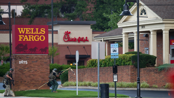 Man claiming to have bomb in bank killed in police standoff