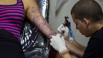 Bird tattoo on woman's back looks like it's really flying?