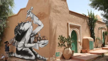 Surreal graffiti art transforms ancient Tunisian village