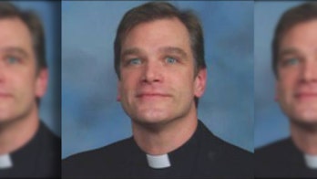 Rainbow-flag burning priest removed from Chicago parish